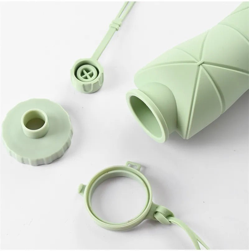 Light green AVIOX silicone foldable water bottle with detached cap and carrying strap
