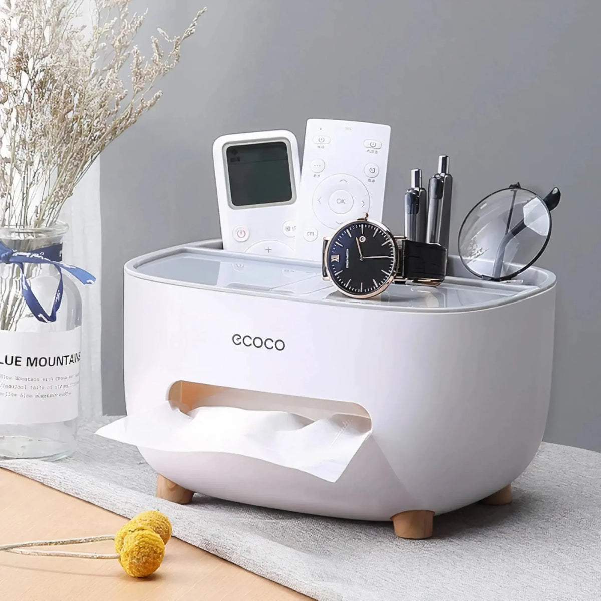 AVIOX luxury multi-functional white tissue box organizer with watch, glasses, and remotes.