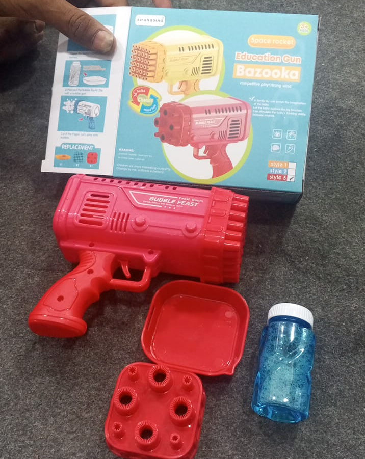 AVIOX red automatic bubble gun toy with bubble solution and replacement tray.