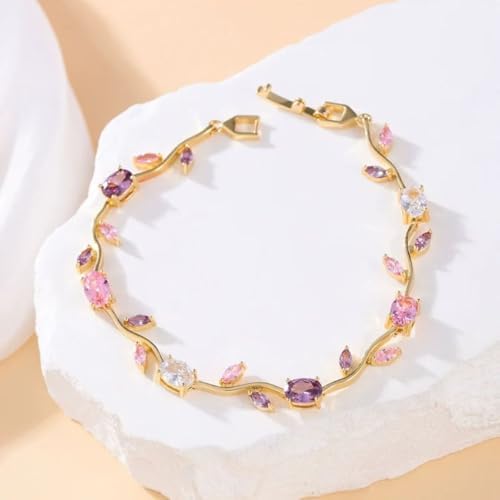 AVIOX gold-toned floral bracelet with multi-colored tulip-shaped gemstones on a white stone surface