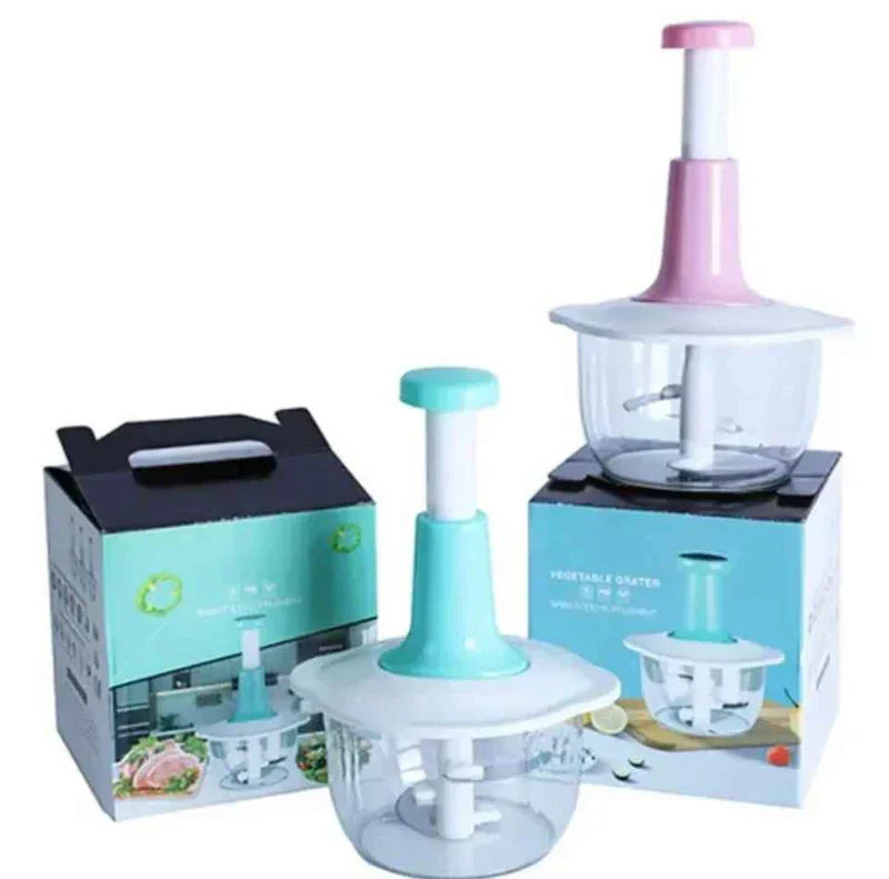 AVIOX manual press food chopper in pink and teal with product packaging