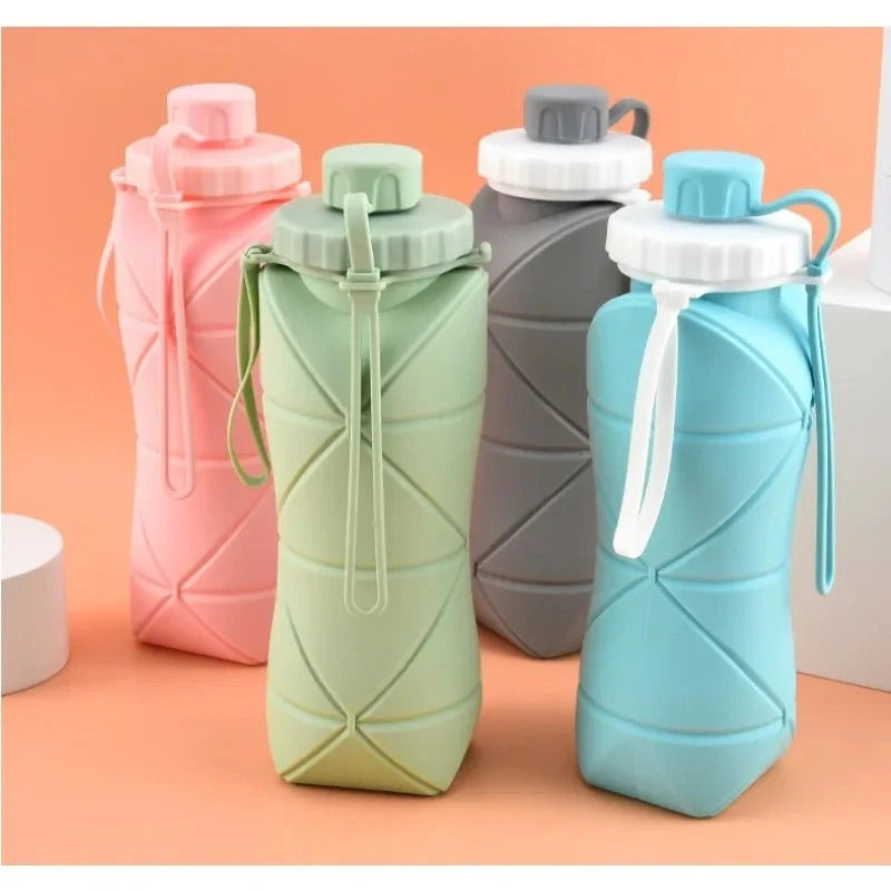 Four AVIOX silicone foldable water bottles in pink, green, grey, and blue colors.